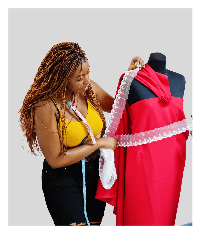 Designer draping fabric over a dress form